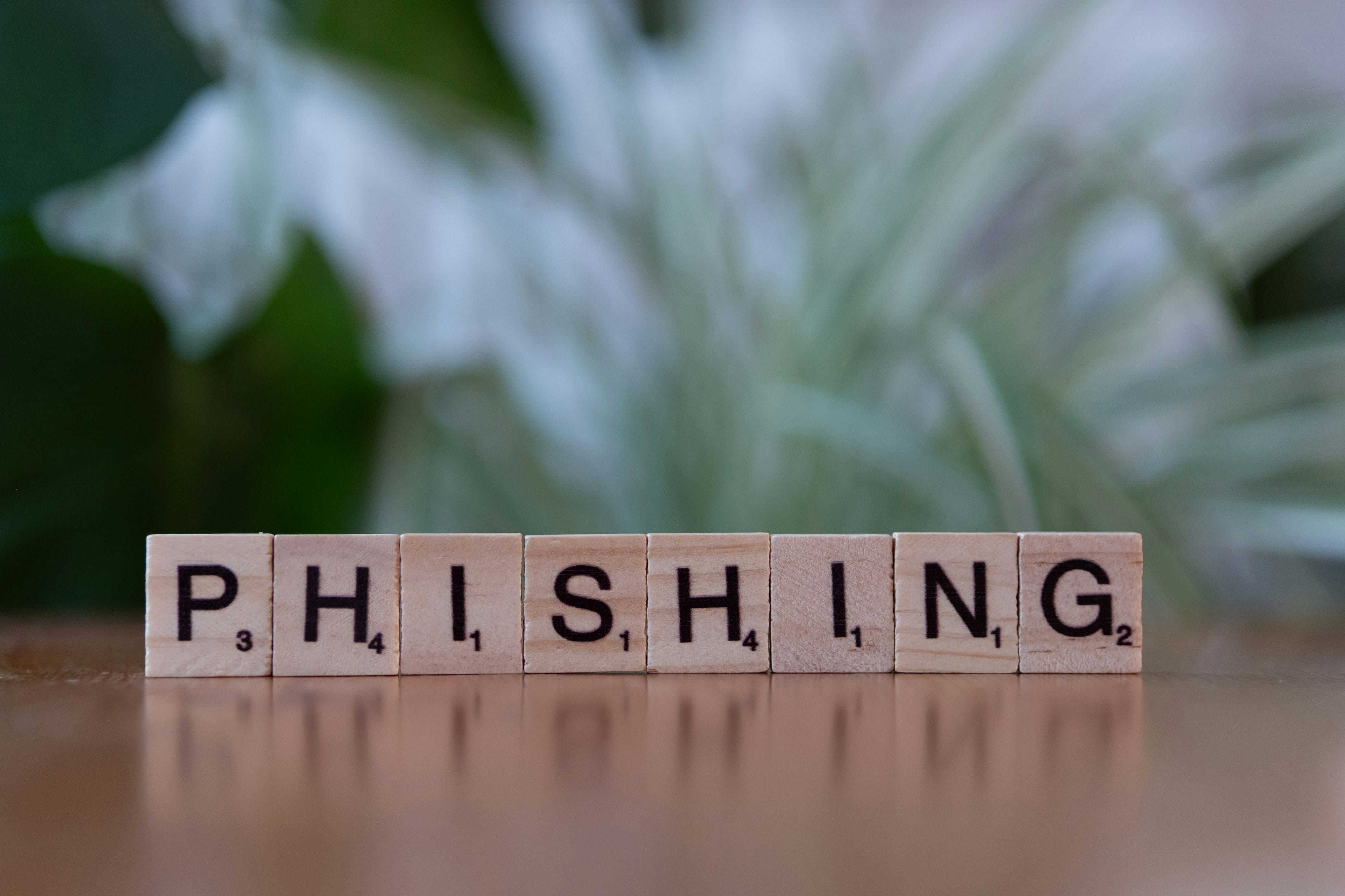 Letter tiles spelling the word PHISHING